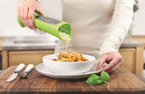 Zeal Tower Grater in vibrant red or green, designed for mess-free cheese grating and easy serving at the table.