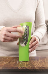 Zeal Tower Grater in vibrant red or green, designed for mess-free cheese grating and easy serving at the table.