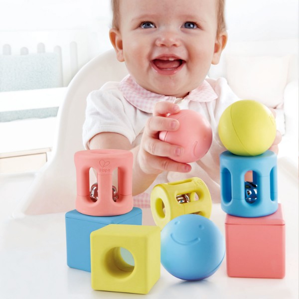 Geometric Rattle Trio by Hape features eco-friendly, colorful shapes designed for babies to grasp, shake, and explore.