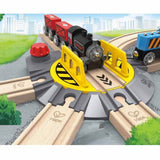 Colorful Adjustable Rail Turntable for toddlers, featuring a turning mechanism and spacious area for toy train engines.