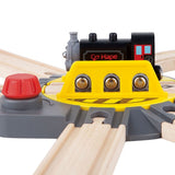 Adjustable Rail Turntable for toddlers, featuring a big red knob for six track directions and a spacious holding area.