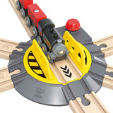 Adjustable Rail Turntable by Hape, featuring a big red knob for directing trains and a spacious central area for engines.