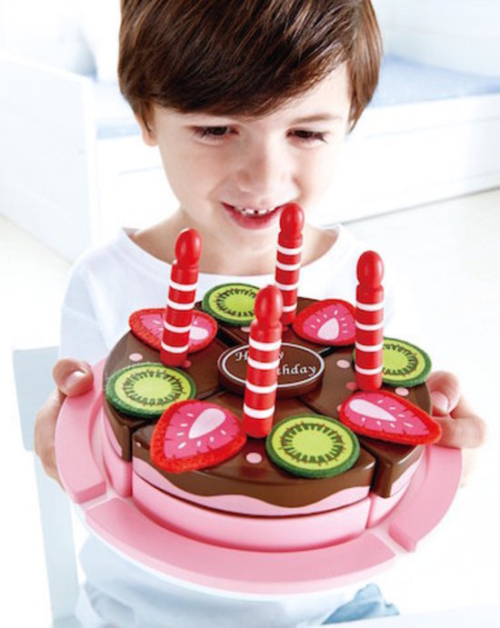 Colorful toy birthday cake from Hape, featuring strawberry and chocolate slices, candles, and a birthday card for imaginative play.