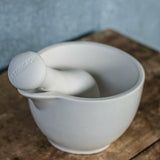 Mason Cash white medium mortar and pestle with unglazed interior for easy grinding of herbs and spices, featuring elegant glazed exterior.