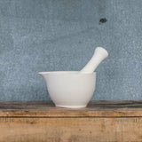 Mason Cash white medium mortar and pestle with unglazed interior for easy grinding of herbs and spices, elegant glazed exterior.