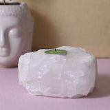 Clear Quartz Tealight Holder showcasing natural elegance, promotes tranquility, holds one standard tealight, unique variations.