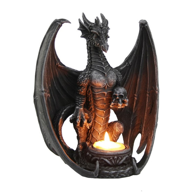 Majestic dragon figurine with arched wings and tealight holder, beautifully crafted in resin for fantasy-themed decor.