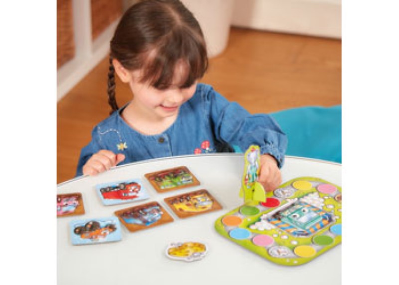 Colorful board game Mucky Trucks from Orchard, featuring trucks, farm scenes, and fun learning activities for kids.