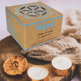 Set of 12 organic tealight candles in metal capsules, hand-poured soy wax with Dehn Al Oudh aroma for ambiance and relaxation.