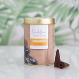 Set of 6 sandalwood backflow incense cones in tins, designed for calming ambiance and mesmerizing smoke cascades.