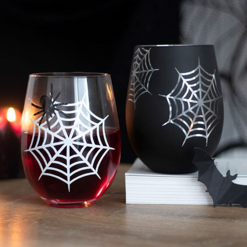 Set of 2 spider and web stemless wine glasses, featuring a printed spider and web design and a shimmering silver interior.