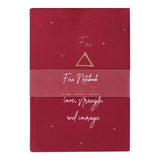 Burgundy velvet notebook with 'Passion, freedom, love, strength, courage' on cover and starry sky design, ideal for creativity.