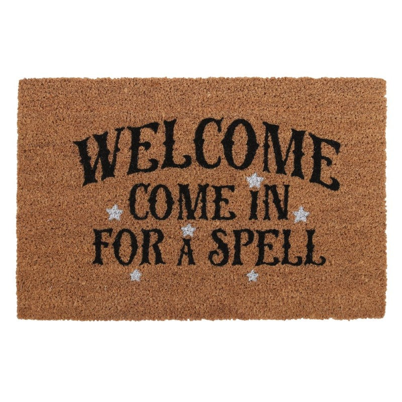 Natural coir doormat with the phrase 'Welcome, Come In For A Spell' and white stars, perfect for witch-themed decor.