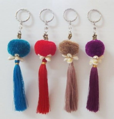 Colorful pom pom shell key rings set of 4, perfect for adding style and functionality to your accessories.