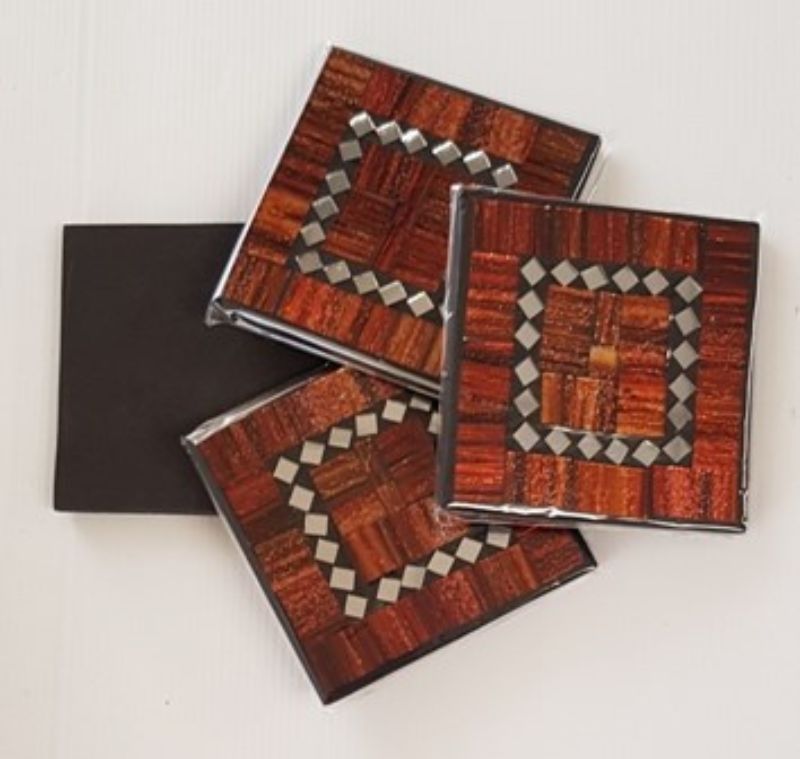 Elegant set of 4 copper mosaic coasters with rubber backing, perfect for protecting surfaces and enhancing home decor.
