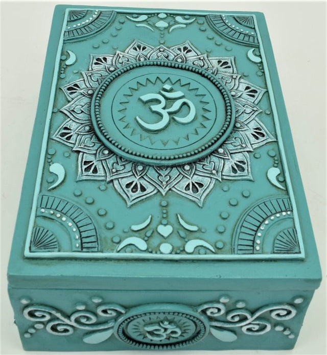 Teal tarot box featuring an Ohm symbol, perfect for storing cards and trinkets, measures 14 x 10 x 6 cm.