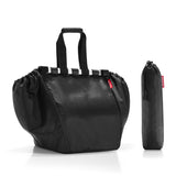 Spacious black Reisenthel Easyshopping Bag, 30L capacity, collapsible design, water-repellent, includes zip pocket and trolley tokens.