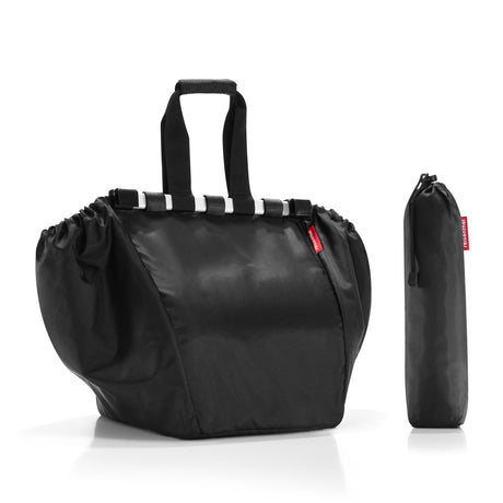 Spacious black Reisenthel Easyshopping Bag, 30L capacity, collapsible design, water-repellent, includes zip pocket and trolley tokens.