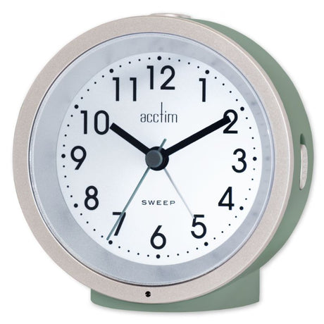 Elegantly designed moss green alarm clock with automatic backlight, non-ticking sweep hand, and easy-to-read Arabic dial.