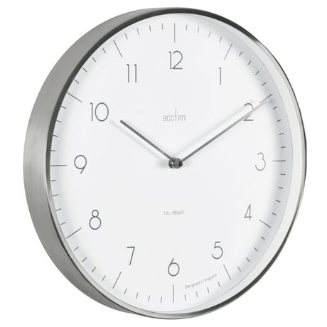 Brushed metal wall clock with white face, embossed numbers, sleek hands; modern decor for any home.