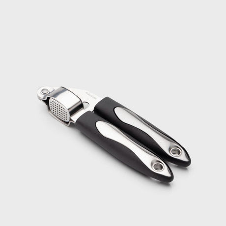 Taylors Garlic Press: Effortlessly crush unpeeled garlic cloves, made from durable stainless steel for easy use and cleaning.