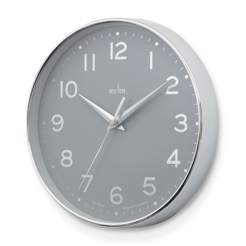Stylish Acctim Rand Wall Clock with chrome frame, foil embossed dial, and silver scissor hands, measuring 20cm.