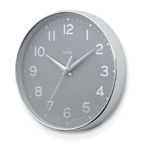 Stylish Acctim Rand Wall Clock with chrome frame, foil embossed dial, and silver scissor hands, measuring 20cm.