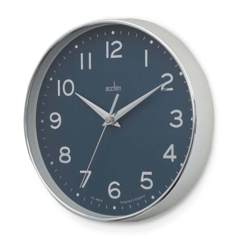 Sleek chrome wall clock with blue embossed dial, debossed numbers, and silver scissor hands for stylish decor and accurate timekeeping.