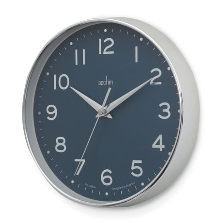 Sleek chrome wall clock with blue embossed dial, debossed numbers, and silver scissor hands for stylish decor and accurate timekeeping.