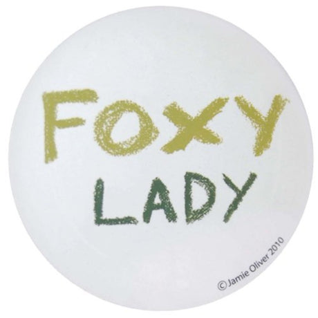 Cheeky round coaster featuring Jamie Oliver's Foxy Lady design, heat-resistant and cork-backed, perfect for stylish decor.