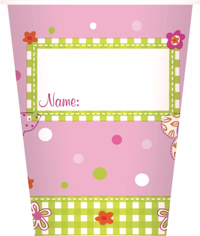 Pink fairy-themed paper cups (20cl, 10PK) perfect for whimsical celebrations, with space for guest names.