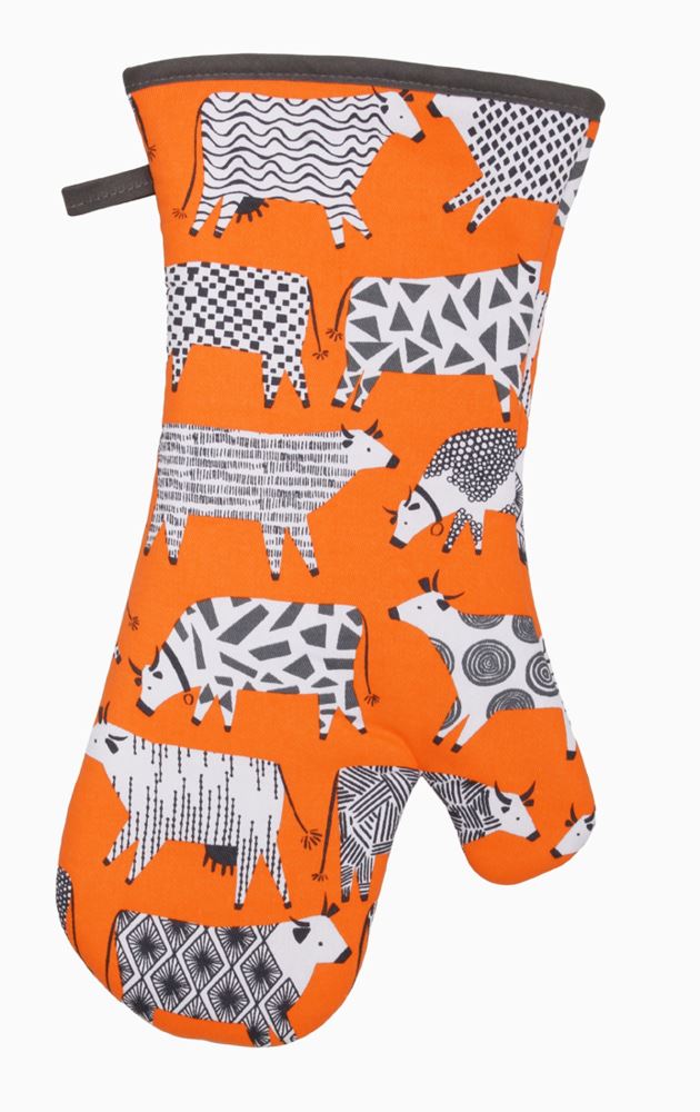 Oven mitt featuring whimsical cow design, crafted by Ulster Weavers, known for high-quality kitchen textiles.