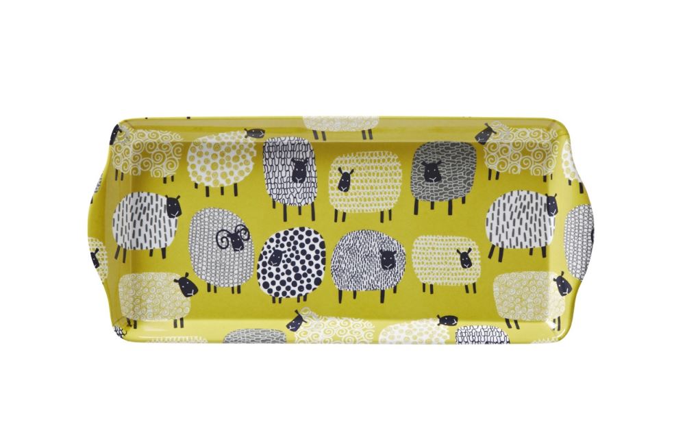 Small round tray featuring a whimsical dotty sheep design, crafted by Ulster Weavers, renowned for quality textile products.