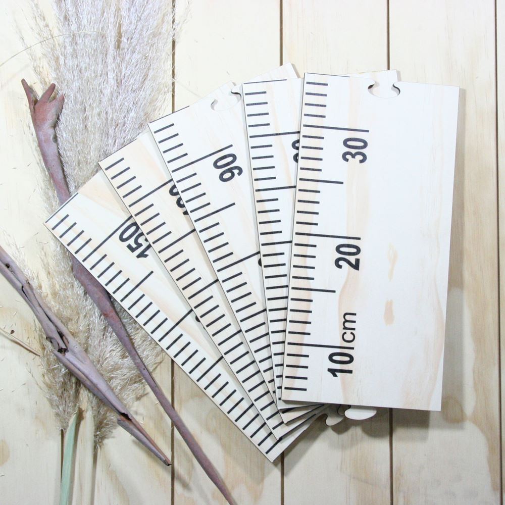 Pine growth chart ruler elegantly tracks children's height up to 1.5 meters, adding charm to any nursery or playroom.