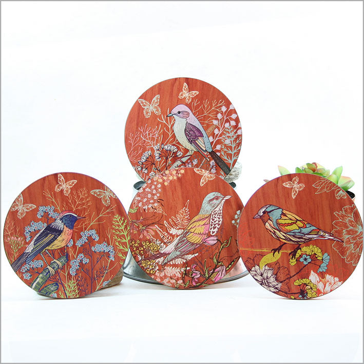 Set of 4 colorful bird coasters made of durable MDF with cork base, perfect for protecting surfaces and enhancing decor.