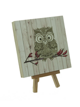 Light wood art block featuring Morepork owl print on eco-friendly plywood, ready to hang, perfect for home decor.