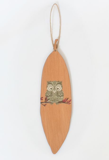 Wall art featuring a Morepork design on Rimu veneer, showcasing a Pohutukawa leaf, ideal for nature lovers' decor.