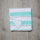 Soft aqua striped dual layer blanket for babies, measuring 38"x38" and made from 100% cotton for comfort and warmth.