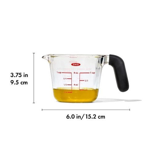 Glass measuring cup with clear markings, thermal shock-resistant, dripless spout, non-slip handle, and dishwasher safe.