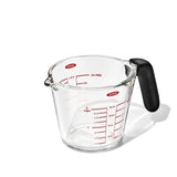 OXO Good Grips 2-Cup Glass Measuring Cup with easy-read markings, dripless spout, and non-slip handle for mess-free pouring.