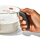 Clear glass measuring cup with easy-to-read markings, spill-proof spout, and non-slip handle for precise cooking.