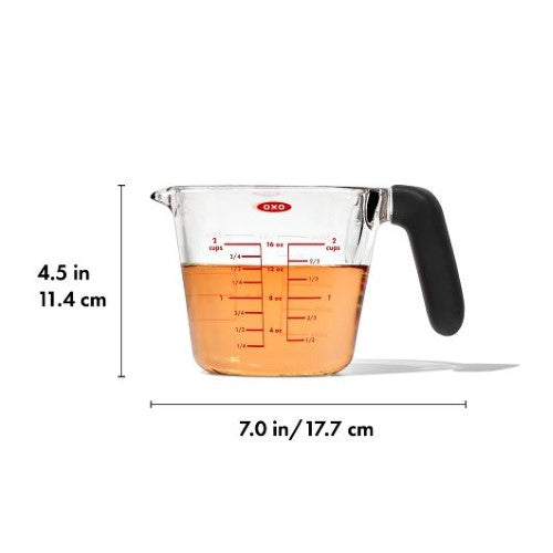 2-Cup OXO Good Grips Glass Measuring Cup with dripless spout, easy-to-read markings, and non-slip handle for precise pouring.