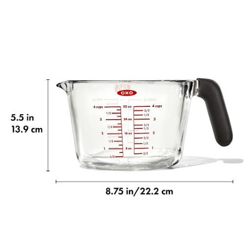 Borosilicate glass measuring cup with dripless spout, silicone lid, and non-slip handle for precise cooking and baking.