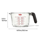 Borosilicate glass measuring cup with dripless spout, silicone lid, and non-slip handle for precise cooking and baking.