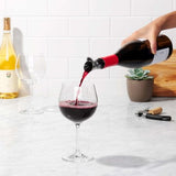 OXO STEEL Wine Stopper & Pourer: Elegant stainless steel tool for controlled pouring, sealing, and preserving wine freshness.