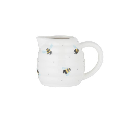 Charming 125ml ceramic milk jug with bee hive design and ribbed texture, perfect for serving milk or sauces.