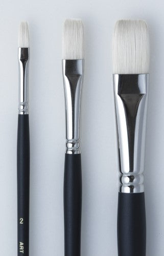 Flat hog bristle brush with durable ferrules for precision painting in acrylics and oils, ideal for artists.