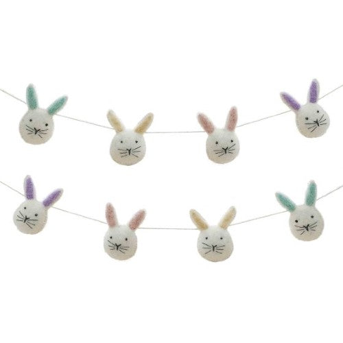 Whimsical fabric bunting featuring 8 unique felt bunny heads, perfect for children's parties and festive occasions.