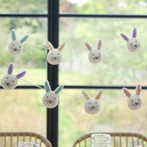 Whimsical fabric bunting with 8 felted bunny heads, measuring 1.5m, perfect for children's parties and celebrations.