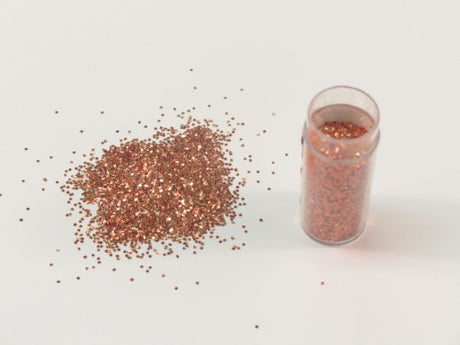 Edible glitter in vibrant apricot hue, perfect for cake decorating and enhancing desserts with a shimmering touch.